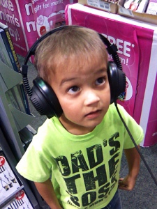 kid listening to headphones